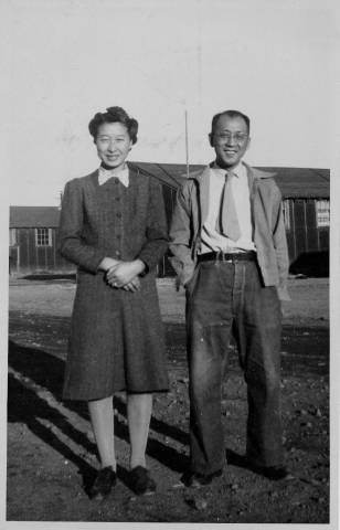 Dr. Taro Akamatsu with wife, Yasuka Akamatsu, standing outside at Tule Lake Relocation Center