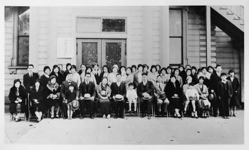 Group of Japanese Americans in front of building at 3rd and "O" Streets in Sacramento
