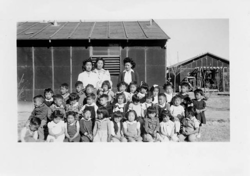 Group photo of pre-school or elementary students at Poston II Relocation Center