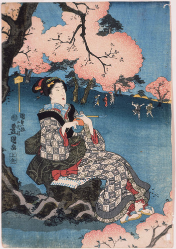 Woman seated beneath a cherry tree