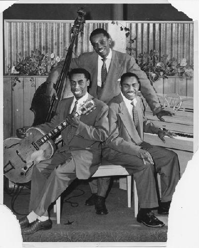 Musicians Bob Lewis (bass), Norvell Randell (piano), Eric Miller (guitar)