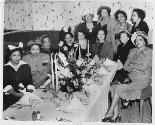 Group of women seated at banquet table at Slim Jenkins Bar and Restaurant Oakland, California