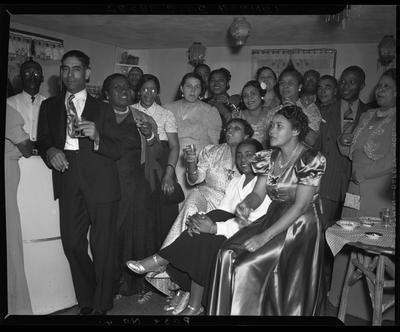 Group photograph of men and women celebrating at the Texas Blue Bonnet