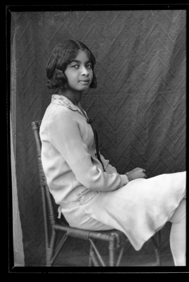 Portrait of girl sitting in chair