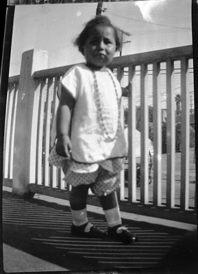 Gloria Roberts standing on front porch