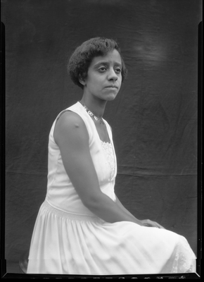 Portrait of a young woman in a sleeveless dress