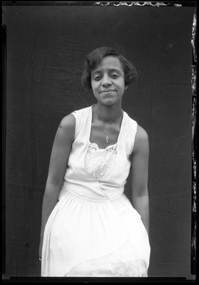 Portrait of a young woman in a sleeveless dress