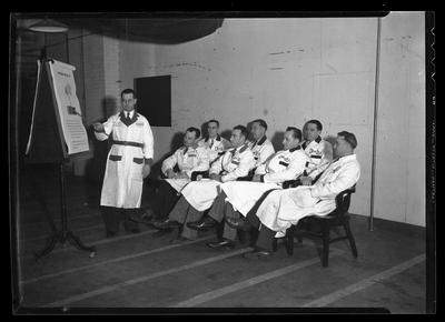 Man giving presentation to Don Lee Oldsmobile employees