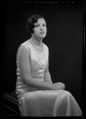 Portrait of a young woman in a sleeveless dress