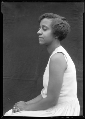 Portrait of a young woman in a sleeveless dress