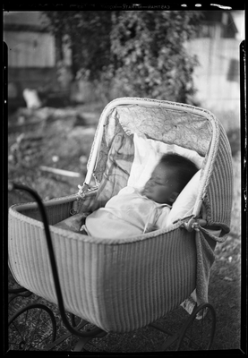 Baby in wicker carriage