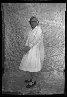 Portrait of a young woman wearing round glasses