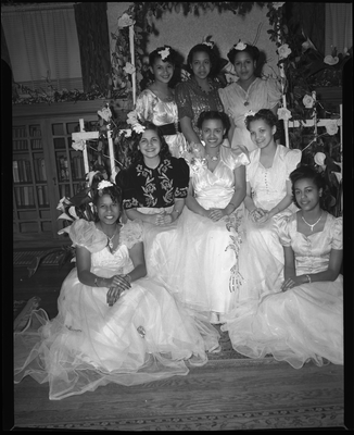 Group portrait of young women in living room