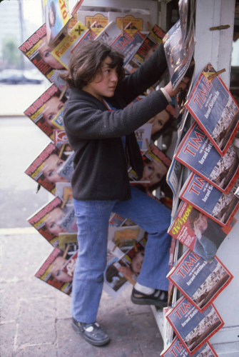 A young girl sells magazines, Mexico, ca. 1983