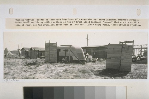 Typical privies - scores of them have been hurriedly erected - that serve Richmond Shipyard workers. Other families, living within a block or two of brush-lined Richmond "creeks" that are dry at this time of year, use the gravelled creek beds as latrines. After heavy rains, these lowlands overflow