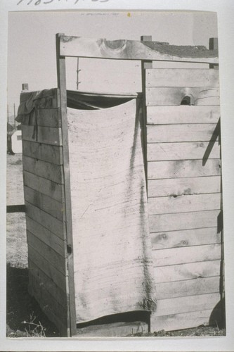 Typical privies - scores of them have been hurriedly erected - that serve Richmond Shipyard workers. Other families, living within a block or two of brush-lined Richmond "creeks" that are dry at this time of year, use the gravelled creek beds as latrines. After heavy rains, these lowlands overflow