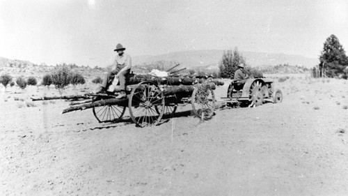 Tractor hauling logs