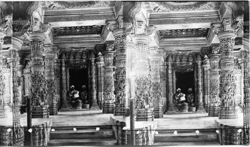 The beautiful carved Pillars and the altar door of Delwara Temple, Mt. Aboo, India