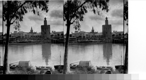 Tower of gold and the cathedral from across the Guadalquivir River. Seville, Spain. Sep. '31 service - description