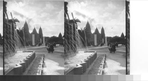 Sunset time from the Timbucktoo Fountain. Angkor vat at Spires silhouetted - French Colonial Exposition. Paris, France