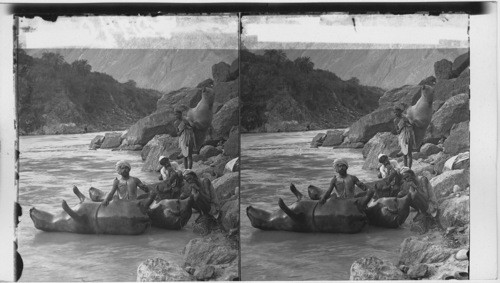 Boatmen inflating bullock skin boats - sutley River. India