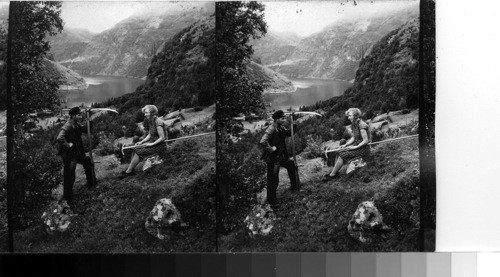 Haymaking above the Geiranger Fjord. Norway