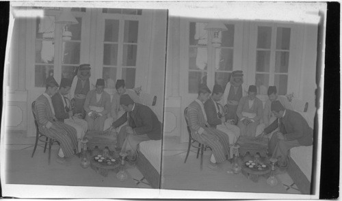 Turkish residents of Nazareth playing checkers and smoking narghiles