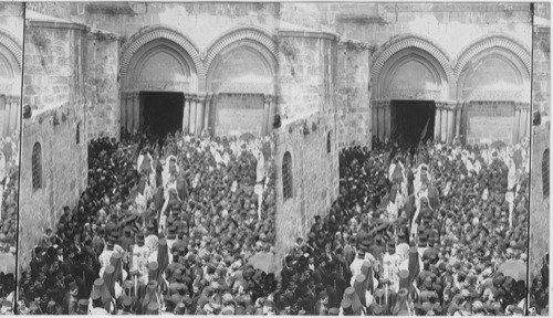 Pilgrims struggling to reach the “Holy Fire” Church of the Holy Sepulchre, Jerusalem, Palestine