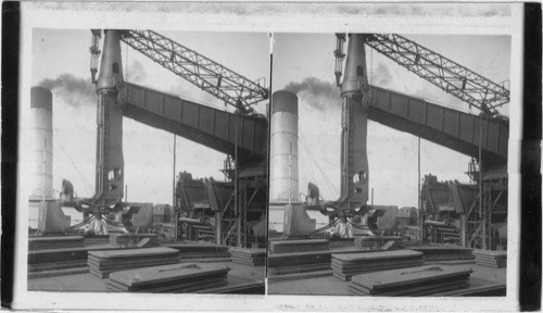 Clam just after discharging its ten tons of iron ore and returning to hold. Conneaut Creek, Cleveland, Ohio. Conneaut?