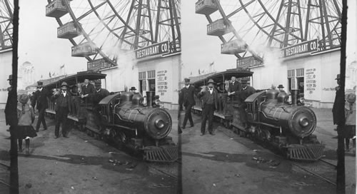 One of the miniature train carrying passengers about the grounds and [a] portion of the huge Ferris Wheel. St. Louis World's Fair, Missouri. [missing neg 7/98]