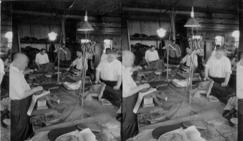 Pressing men's clothes in an improved type of N.Y. City sweatshop