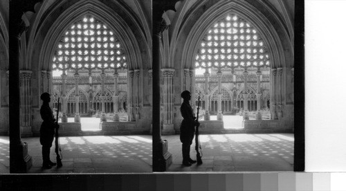 The Cloisters of Sao Jeronimo Monastery. A soldier guards the entrance to the tomb of The Unknown Soldier, Belem Cathedral, Lisbon, Portugal