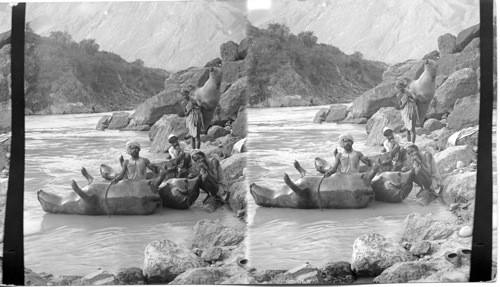 Boatmen inflating bullock skin-boats - Sutley River. India