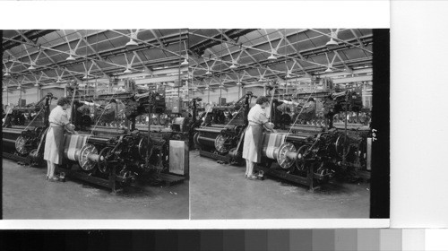 Little borough near Manchester: the Easlee mill of the Fothergill and Harvey company, one of the Manchester's larger manufacturing companies. This mill, although part of a cotton mill operation, is devoted to spinning and weaving of plastic and nylon fabrics. this machine is weaving nylon seat cover fabric. Altho' [although] Manchester is the center of Britain's cotton manufacturing industry, the plants are now for the most part in the surrounding suburbs