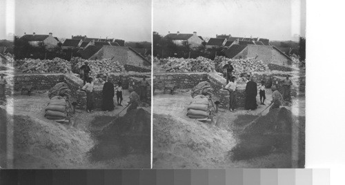 Reconstruction work on the new church at Lucy just begun. (Sept. 1930)