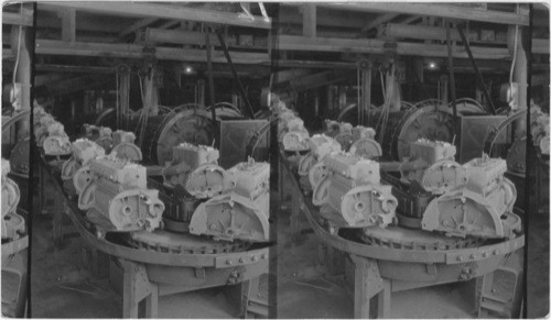 Motor Blocks coming from Metal pouring process going to the "Tumbling". Ford Motor Plant, Detroit, Mich