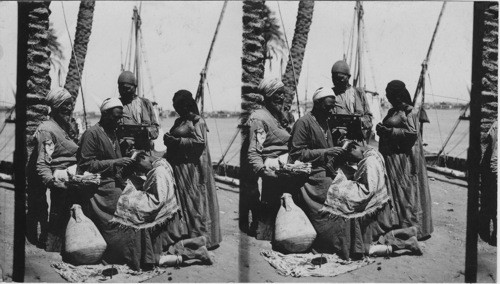 Arab barbers at work scene on the Nile, Cairo, Egypt