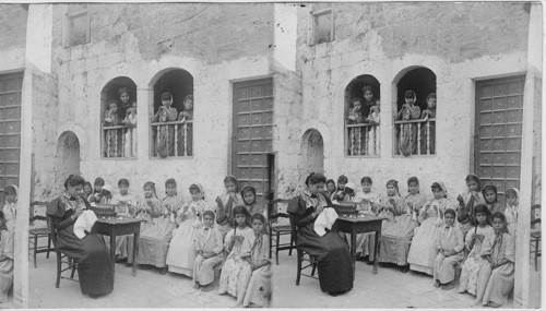 A sewing class at Lydda, Palestine