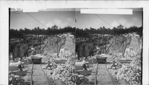 Granite quarries, with derricks, cars, and finished blocks, Concord, N. H