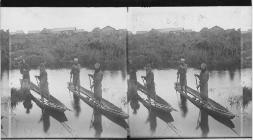 Ainu fishermen in their primitive boats, Yezo