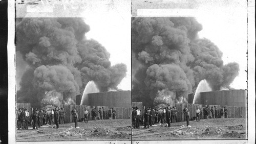 Fighting huge fire, standard oil tanks, Bayonne, New Jersey. U.S. 1900