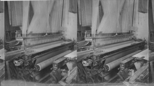 Weaving linen at Guelph, Ont. 72 inch wide Damask Linen Table Cloth. Machine works automatically without operators