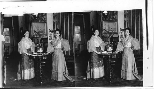 Inside a pleasant Filipino home - showing typical costumes, Manila. P.I