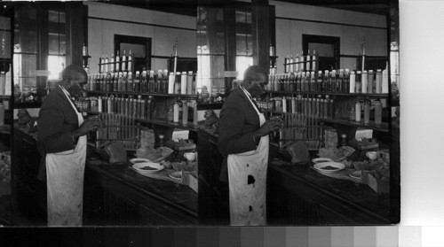 Prof. G.W. Carver in his agricultural research laboratory at Tuskeegee [Tuskegee] Institute, Alabama