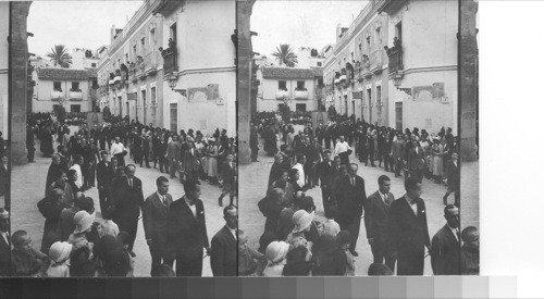 A religious procession outside the walls of the Mesquita. Cordoba, Spain