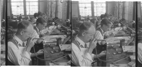 Finishing rings, nearest worker is soldering the two halves of an engagement ring. Jabel Ring Co, Newark, N.J