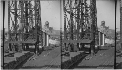 Car loaded with coal coming out of carriage (and shaft) and going up to the "Breakers", "Empties" going down. Scranton, Pa