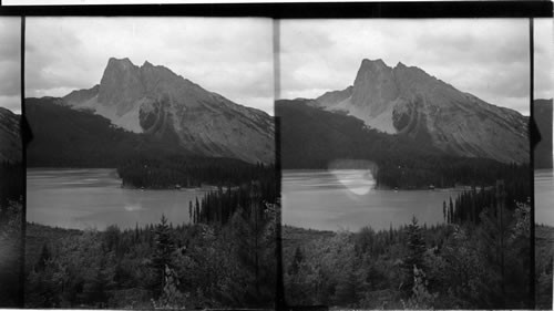 Emerald Lake and Rugged Mt. Burgers, Rocky Mountains. B.C. Can