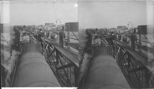 Loading oil on tank cars. Crushing Oil Field. Oklahoma