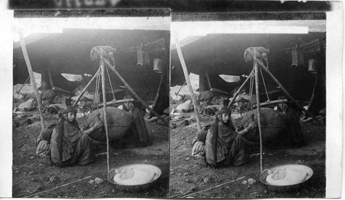 Bedouin women churning milk, typical interior of a big feast, Palestine